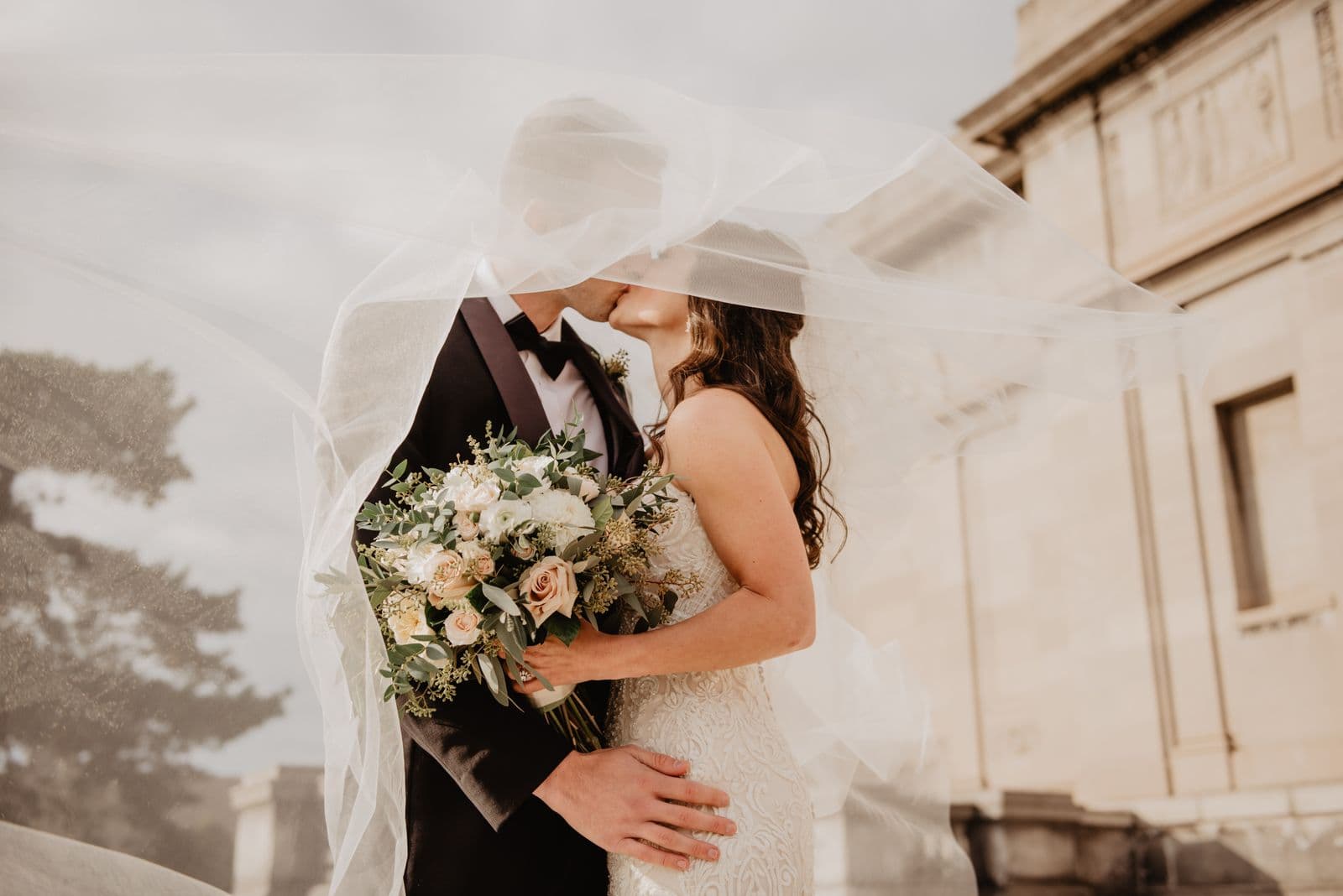 Bride in lace gown during a private fitting at Ohana Bridal